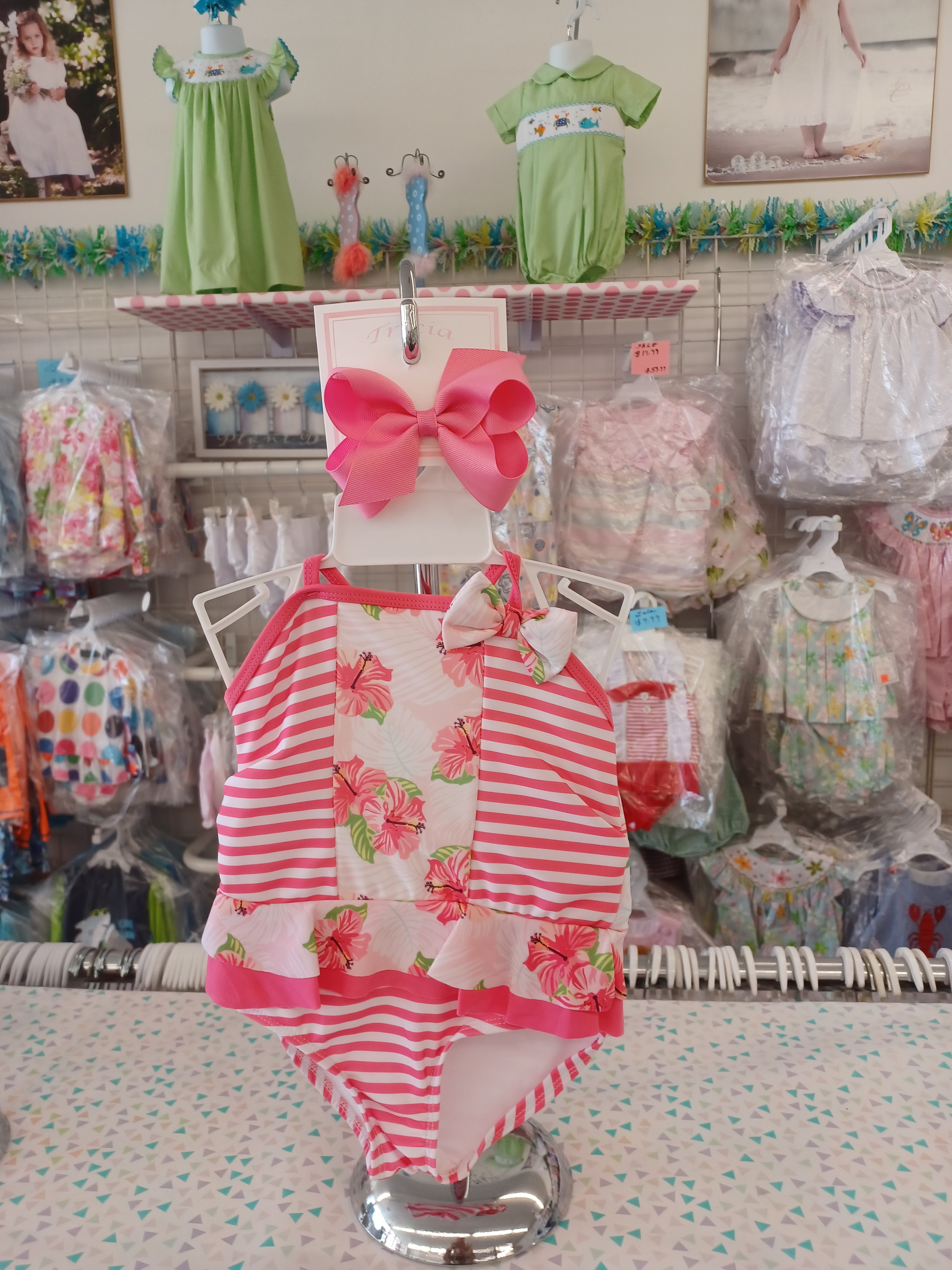 Pink and White Swimsuit With Flowers